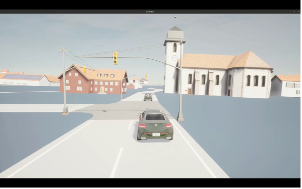 The image shows a road with traffic lights and a car in didymos
