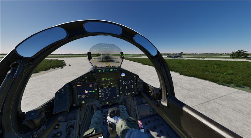 This image shows the Virtual view, which the jetpilot, wearing the VR headset can see. It is the virtual replicate of a jet cockpit