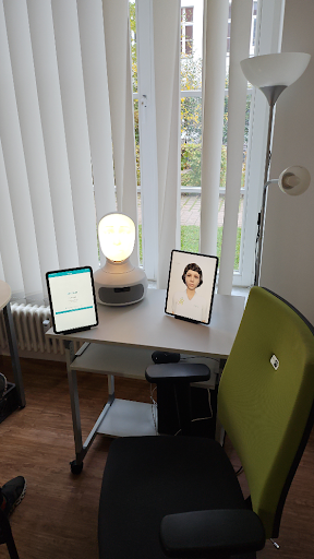 A workplace showing two tablets, with the miaprom software. On of them is showing the virtual avatar